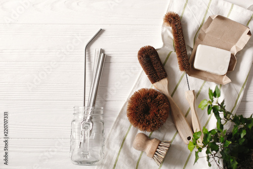 zero waste food cleaning. eco natural coconut soap and brushes for washing dishes, metal straws, eco friendly flat lay. sustainable lifestyle concept. plastic free items. reuse, reduce