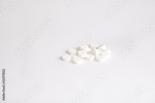 white pills on white background (warm toned)