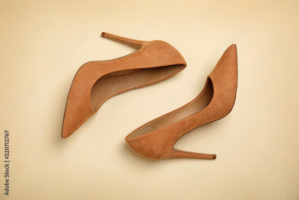 Pair of beautiful shoes on color background, top view Pair of beautiful shoes on color background, top view