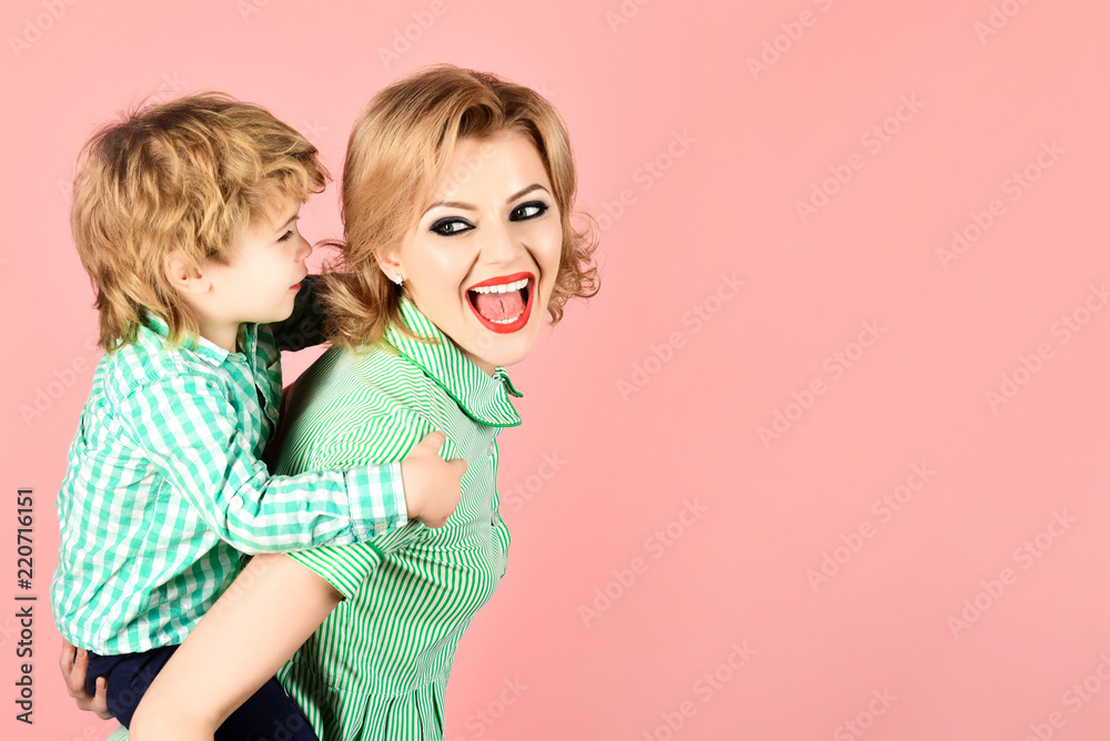 Happy family. Mother and son smiling. Blond mother holding boy on piggyback. Family time together. Motherhood concept. Mom and toddler having fun together. Little kid express love to mommy. Copy space Happy family. Mother and son smiling. Blond mother holding boy on piggyback. Family time together. Motherhood concept. Mom and toddler having fun together. Little kid express love to mommy. Copy space