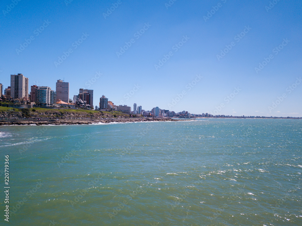 Naklejka premium Sky view of Mar del Plata Argentina – high resolution drone photo of the Argentinian coast and downtown area of Mar del Plata Casino Central in spring time. Buenos Aires Capital Federal district 