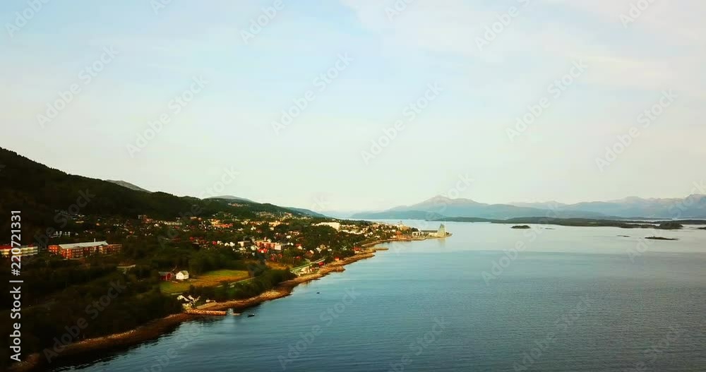 Molde, Norway. Aerial view of residential area andcity center in Molde, Norway in the evening. Beautiful fjord with mountains Molde, Norway. Aerial view of residential area andcity center in Molde, Norway in the evening. Beautiful fjord with mountains