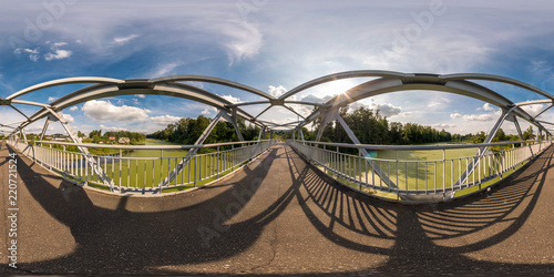 full seamless spherical panorama 360 by 180 angle view neariron steel frame construction of pedestrian bridge across the river in equirectangular projection  skybox VR virtual reality content