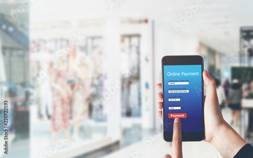 Woman holding smartphone to enter online payment from the store. Concept of providing marketing services on the internet for easy access to information.