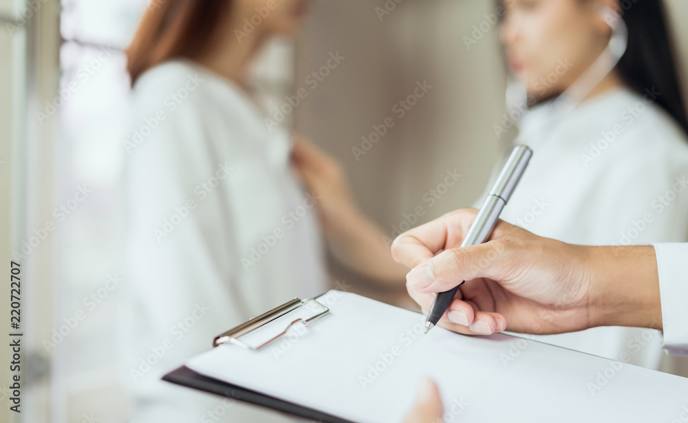 The doctor provides consultation with the patient and records the treatment history thoroughly. healthcare and professionalism concept. The doctor provides consultation with the patient and records the treatment history thoroughly. healthcare and professionalism concept.