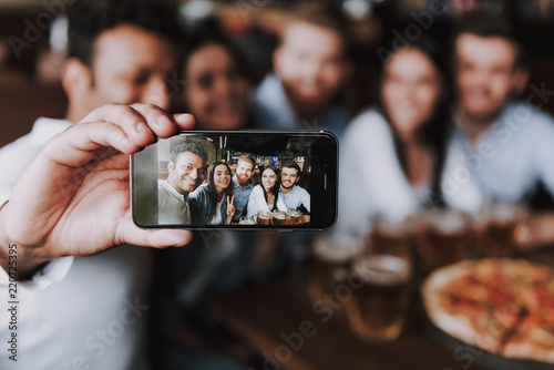 Company Smiling Friends Making Selfie in Pub