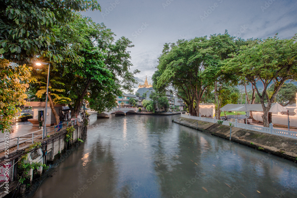Fototapeta premium Night view and rain shower in Mahakarn fort, Mahachai Road, Wat Boraveiwet, Pom Prap Sattru Phai, Bangkok, Thailand