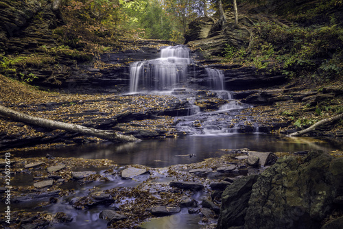 Autumn Leaves Cover Rocks Surrounding a Waterfall in Ricketts Glen State Park in Pennsylvania