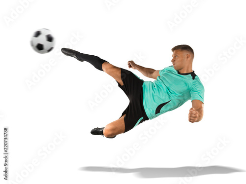 soccer player kicking the ball in the air isolated on white © 27mistral