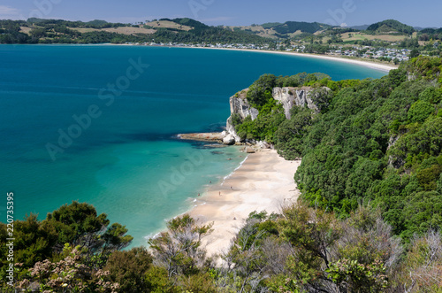 Elevated view of beautiful, sandy Lonely Bay with Cooks Beach in the background. Mercury Bay, Coromandel, New Zealand.