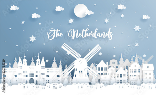 Winter and Christmas in The Netherlands with landmark, city, windmill and falling snow. Paper cut style vector illustration.