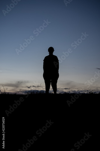 Silhouette of a woman outdoors