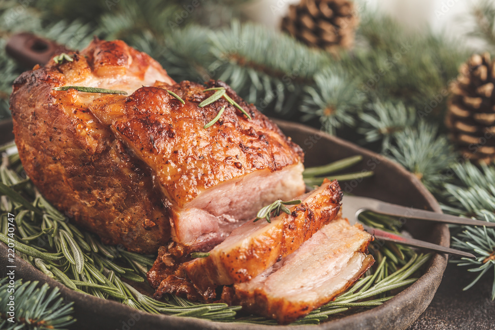 Baked Christmas pork (ham) with rosemary. Christmas decoration, festive background concept. Baked Christmas pork (ham) with rosemary. Christmas decoration, festive background concept.