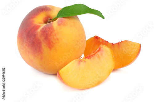 peach fruit with green leaf and slices isolated on white background