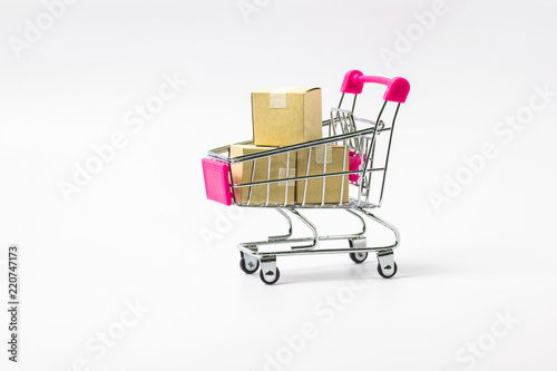 Shopping cart with paper cartons on white background.