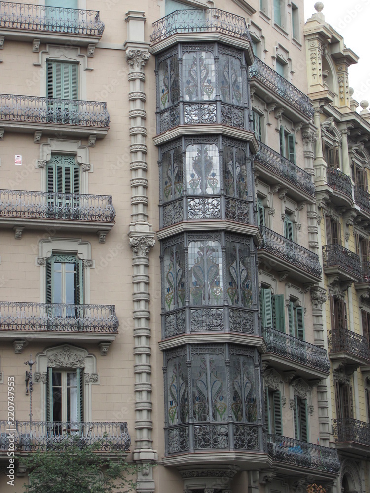 Fragment of the facade of a beautiful house with glazed balconies