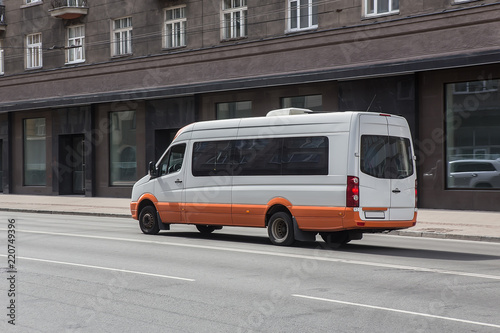 minibus goes on the city street