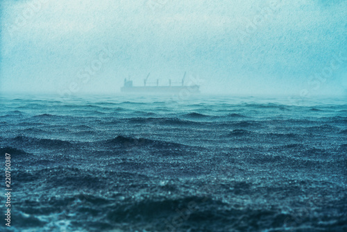 Fototapeta Naklejka Na Ścianę i Meble -  Rain over the sea waves, natural background