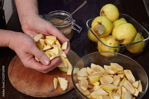 The man cooks quince jam