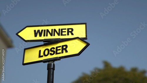 A road sign with winner loser words. 3d image.  © Jane
