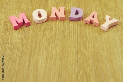 Wallpaper Mural colorful monday alphabet letters on wooden background Torontodigital.ca