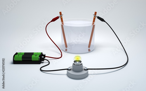 Electrolysis of water with battery and bulb on white background. Strong electrolyte burn a light bulb.  photo