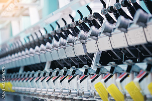Textile factory. Factory on manufacture of threads. Rows of automated machines for yarn manufacturing. Modern Textile Plant.