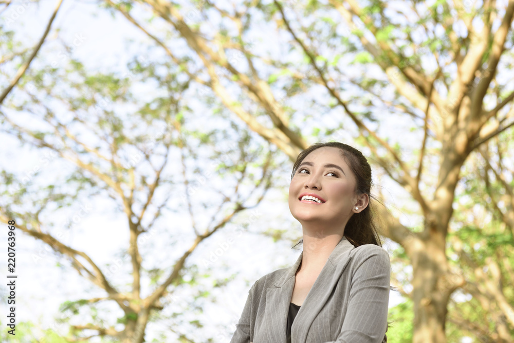 Smiling asian business woman with happy expression Smiling asian business woman with happy expression