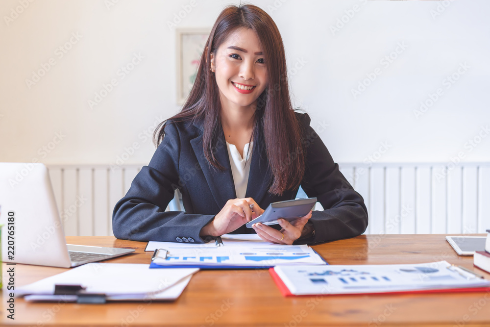 Beautiful young asia woman working in office. Beautiful young asia woman working in office.