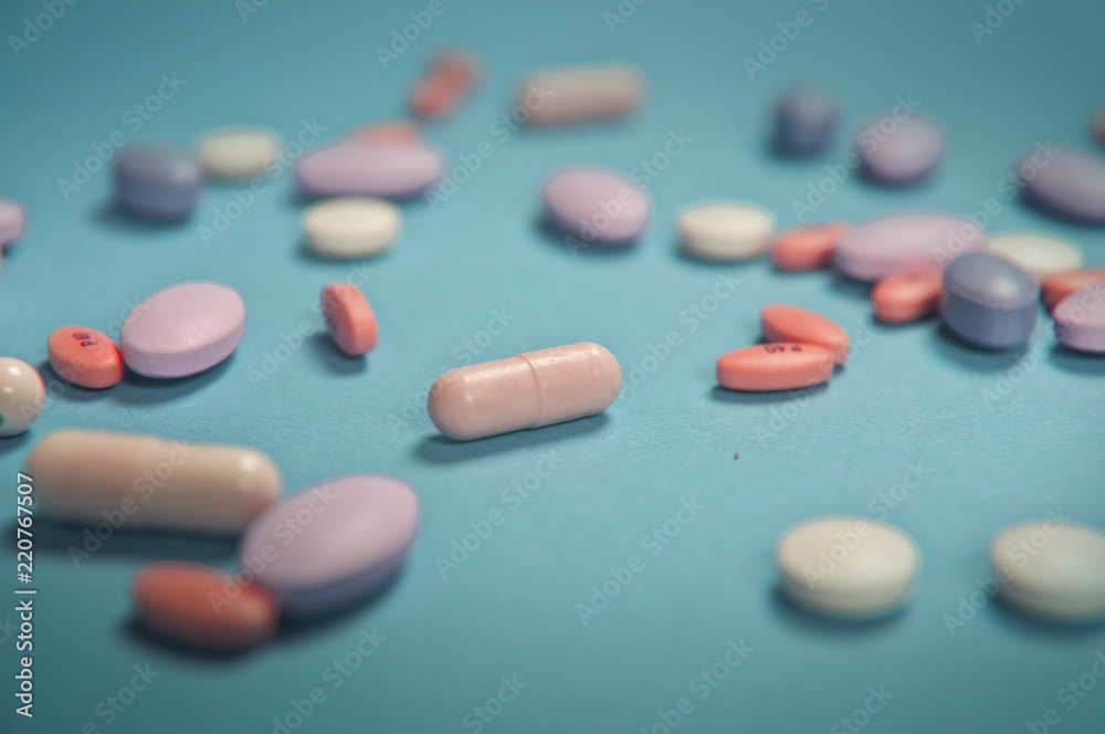 Medical pills on blue background Medical pills on blue background