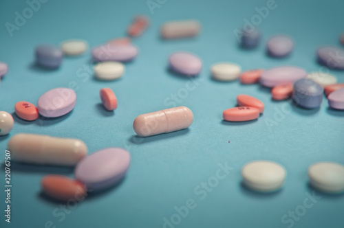 Medical pills on blue background