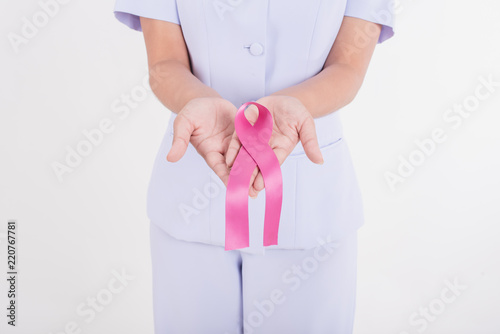 Asian nurse with pink ribbon. Pink ribbon is an international symbol of breast cancer awareness.Medicine and healthcare concept