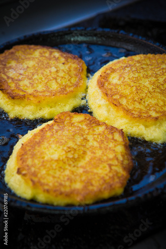potato pancakes in a frying pan