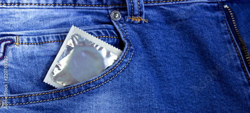 Condom in jeans photo