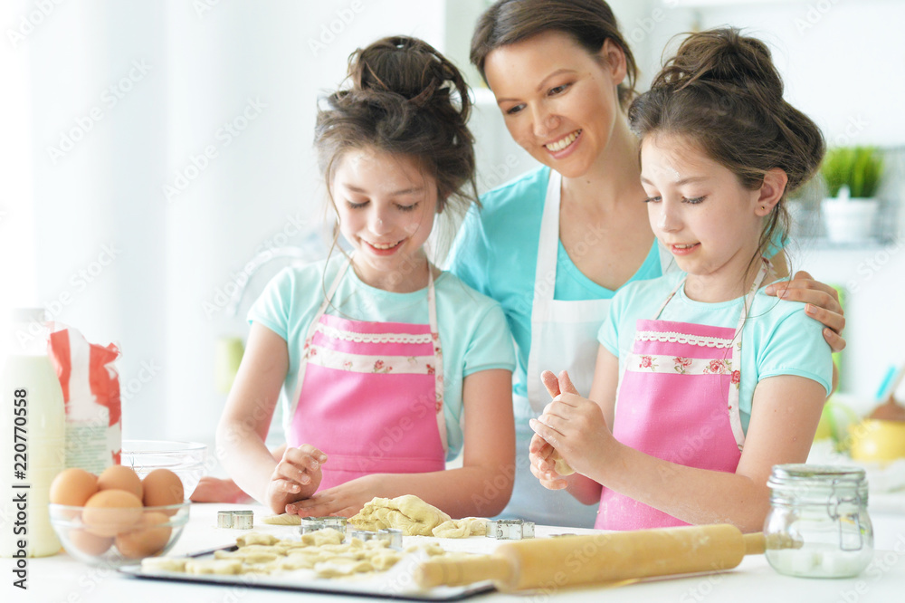Portrait of a mom and daughter cook Portrait of a mom and daughter cook