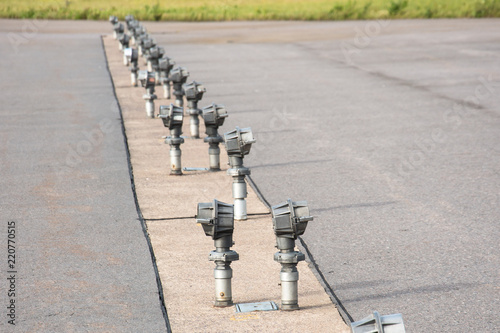 Signal lights on the runway at the airport close up. photo