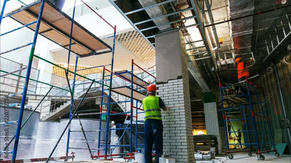 workers team makes finishing operations on scaffolding timelapse