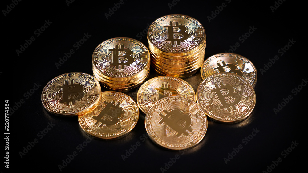 Bitcoin Crypto Currency. Coins on a Dark Background