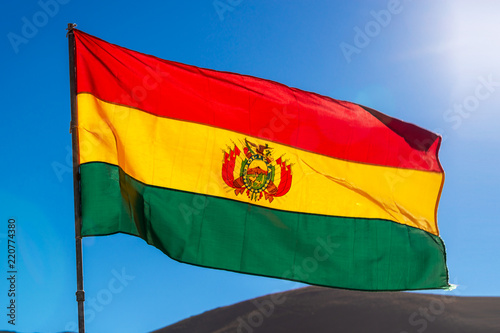 Bolivian flag, blue sky background