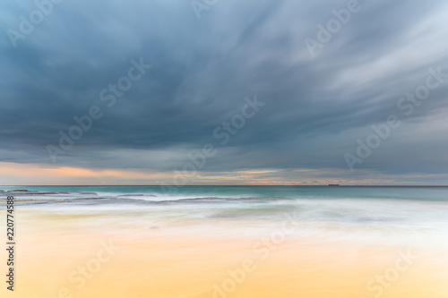 Early morning seascape with heavy clouds