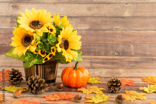 Fototapeta Naklejka Na Ścianę i Meble -  Fall Still Life with Sunflowers , Leaves, Acorns and Pumpkin