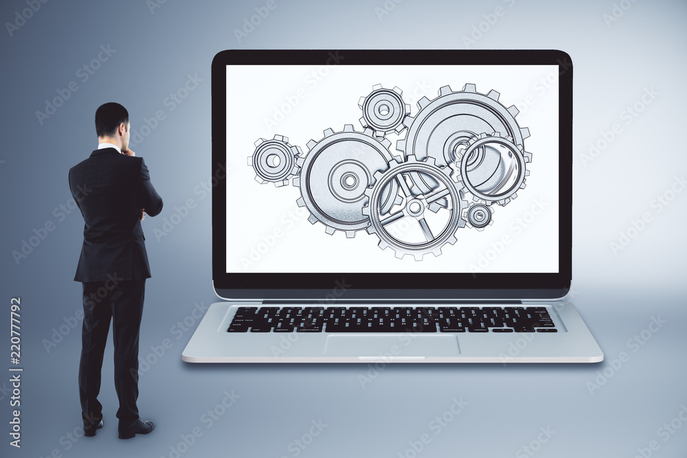 Businessman with cogwheels Businessman with cogwheels