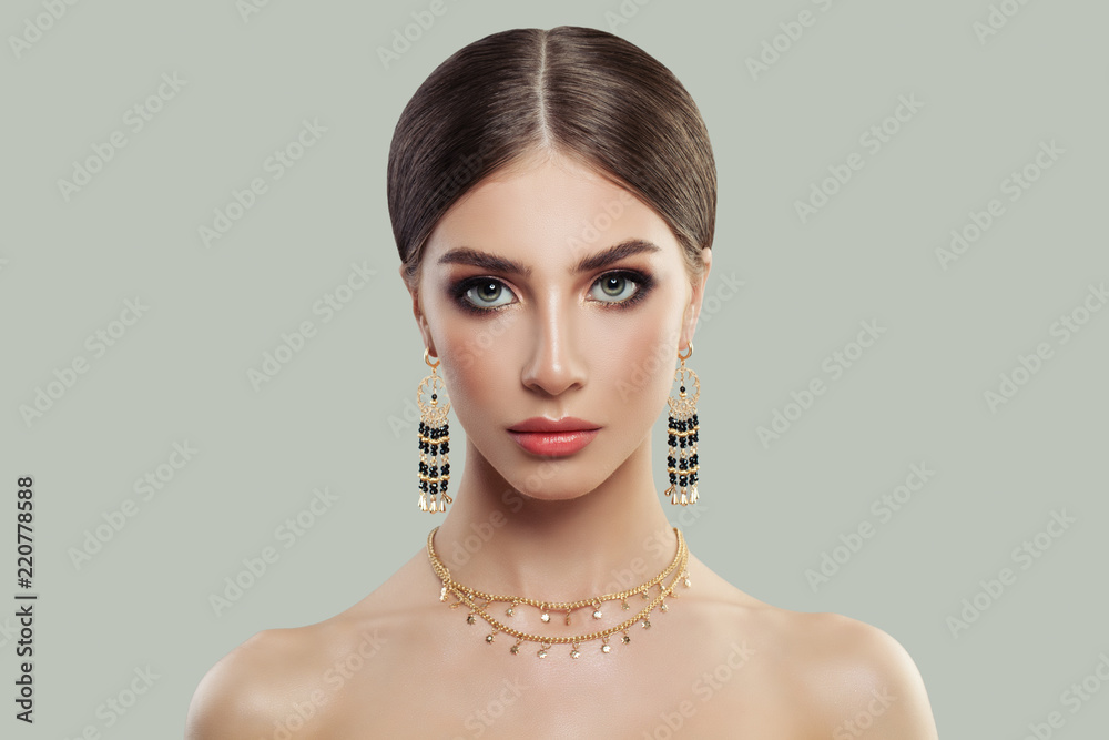 Gorgeous woman with makeup and fashion jewelry
