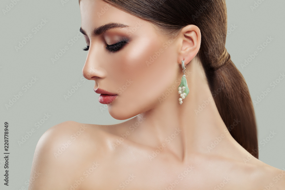 Female model with makeup and fashion jewelry earring with pearls. Beauty  and accessories. Stock-Foto | Adobe Stock
