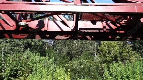 Railway tracklayers. Railroad construction. Railroad track laying machine at work. Supporting machinery on the railway line. Rail-laying machine. photo