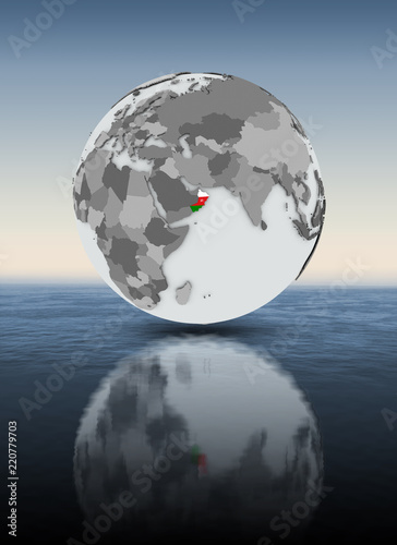 Oman on globe above water