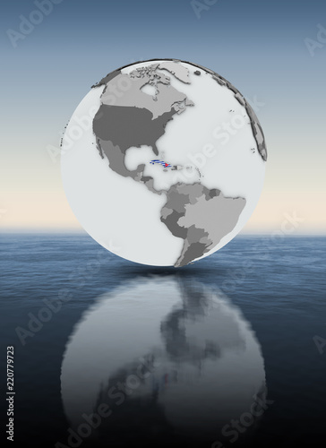Cuba on globe above water