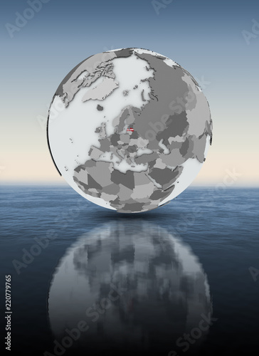 Latvia on globe above water