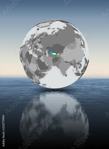 Uzbekistan on globe above water