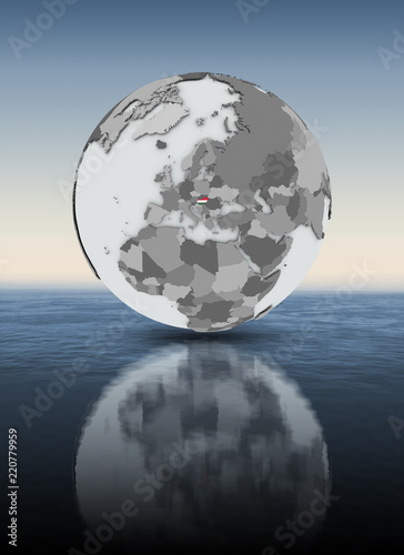 Hungary on globe above water